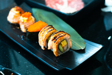  Sushi Roll with salmon, eel, tuna, avocado, royal prawn, cream cheese Philadelphia, caviar tobica, chuka. Sushi menu. Japanese food. 