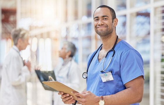 Portrait, clipboard and doctor for healthcare service, leadership and schedule management in hospital lobby. Professional medical worker, person or nurse with clinic checklist, document or compliance
