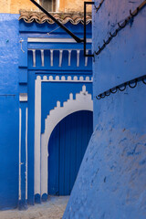 Vibrant blue colored wooden door in downtown Chefchaouen