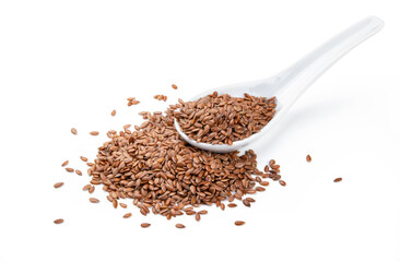 Lin seeds in ceramic spoon isolated on white background, closeup.