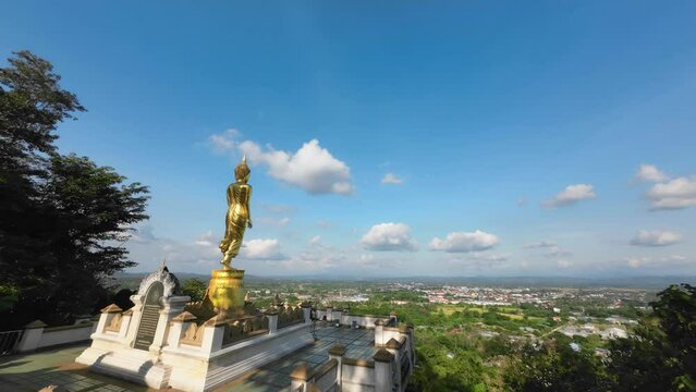 Tranquil Thailand. Clouds, Landmarks, and Buddha Statues in Time Lapse. Wat Phumin, Nan, Thailand