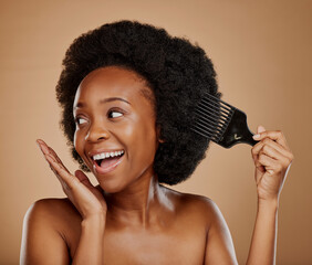 Hair, comb and a happy model black woman in studio on a brown background for beauty or cosmetics. Aesthetic, afro and haircare with an attractive young female person looking excited for natural care