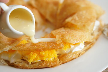 Experience the mouthwatering blend of roti topped with sweetened condensed milk. This delightful and flavorful dessert is a heavenly treat, capturing the essence of traditional cuisine