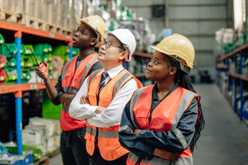 Shot of warehouse members collaborate daily to audit, examine inventory shipments. They organize and monitor storage, update checklists, and communicate effectively to ensure efficient distribution.