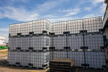 The stock of plastic barrels for the chemical industry. white plastic containers. Chemical industry.