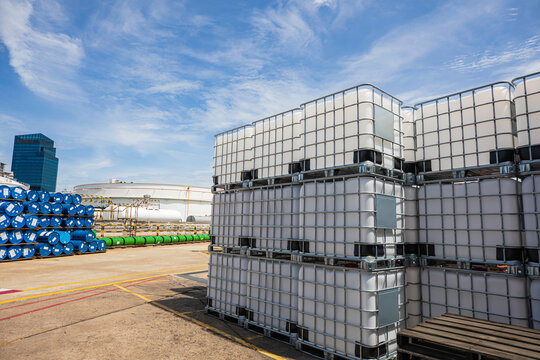 The stock of plastic barrels for the chemical industry. white plastic containers. Chemical industry.