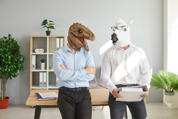 Business people or office workers in funny bizarre animal masks. Two men wearing shirts and unusual...
