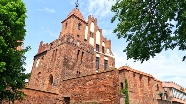 A walk through the historic streets in the center of the old town. Old historic street. Torun, Poland.