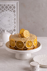 Obraz na płótnie Canvas Cake with oranges and caramel cream