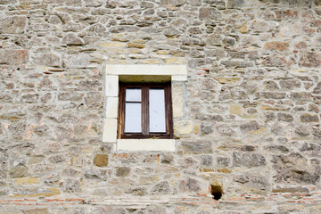 Ancient castle in Spain. Window on the wall