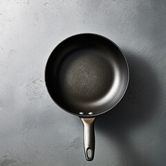 stainless steel pan on a gray background