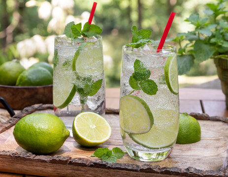 Mojito cocktail with lime and mint leaves