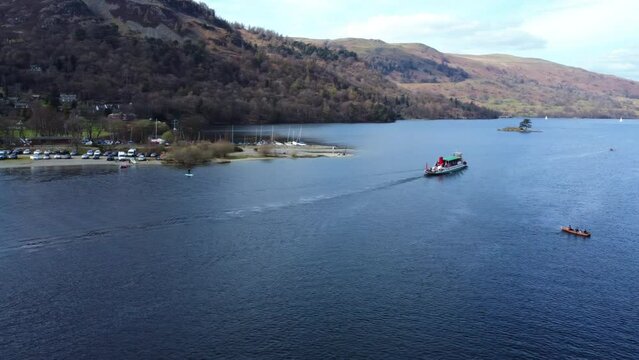 Aerial drone view of boat and nature in Lake District United Kingdom