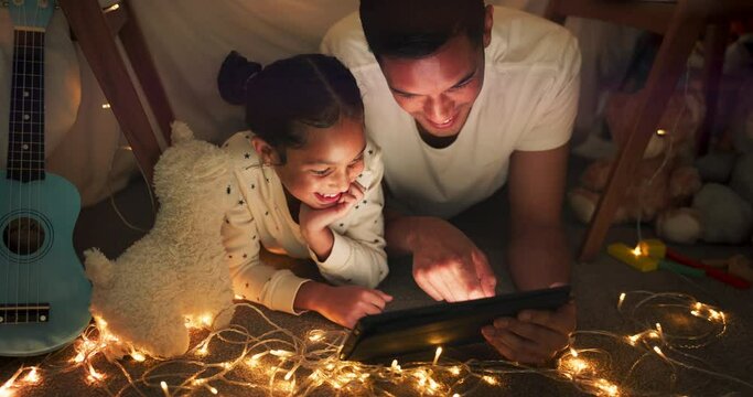 Tent, father and girl on tablet at night watching movies, online games and bedtime story with lights. Happy family, smile and dad with kid in bedroom on digital tech for bonding, relax and love