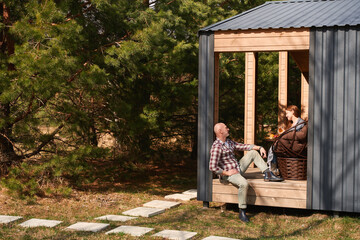 Mature lady and her husband resting in picturesque countryside