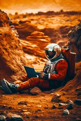 Foto auf Acrylglas Orange Man in space suit sitting on the ground using laptop computer. Generative AI.