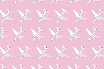 Creative composition made with passenger plane on pastel pink background. Summer travel or vacation pattern. Vector illustration