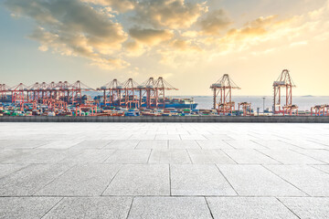 Empty square road and container port background - obrazy, fototapety, plakaty