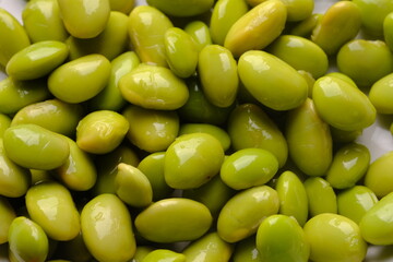 Closeup of peeled edamame. Edamame or mao dou in Chinese, has the Latin name Glycine mas is a tropical plant that belongs to the legume sub-family
