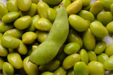 Closeup of peeled edamame. Edamame or mao dou in Chinese, has the Latin name Glycine mas is a tropical plant that belongs to the legume sub-family