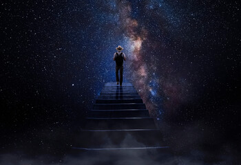 Man observing the universe at the end of the stairs