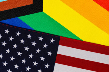 Rainbow pride and American flags. LGBTQ+ discrimination, legislation, and gay rights concept.