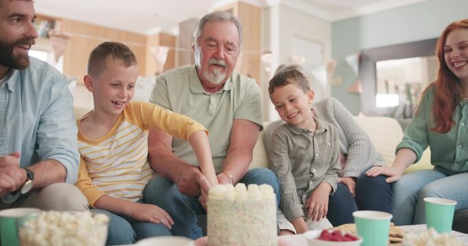 Birthday, big family and cutting cake together for party food, celebration or dessert. Happy, help and kid with a knife for a sweet treat with parents, grandparents and sibling in a house for a treat