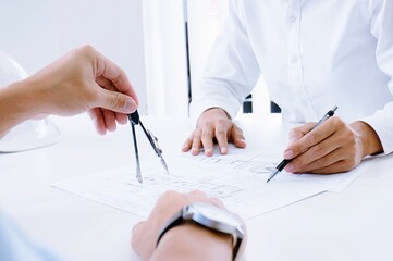 Colleagues interior designer Corporate Achievement Planning Design on blueprint Teamwork Concept...
