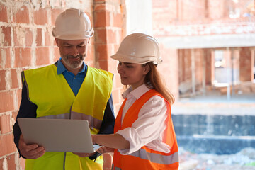 Architect showing on laptop cottage town building stage