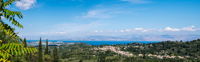 Fototapeta na wymiar Panorama from the top of the mountain to the city of Kerkyra with the runway of the island of Corfu