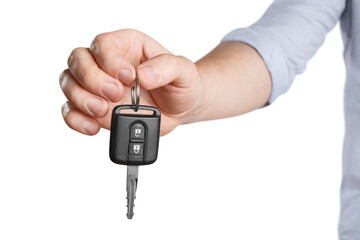 Male hand holding car key, cut out