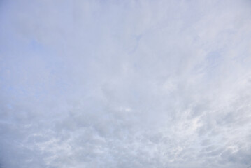 Blue sky and tiny white clouds for background.