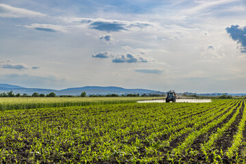 Tractor spraying pesticides