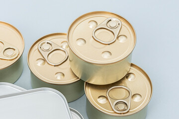 Six tin can (canned food) on the blue background.