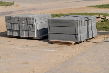 Concrete tiles and curbs made of concrete
