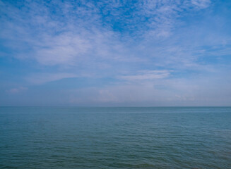 Panorama front view landscape Blue sea rock and sky blue background morning day look calm summer Nature tropical sea Beautiful ocen water travel Bangsaen Beach East thailand Chonburi Exotic horizon.