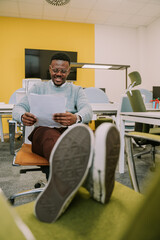 Happy and smiley black business person chilling at the office