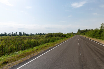 Fototapeta na wymiar Narrow paved road for cars