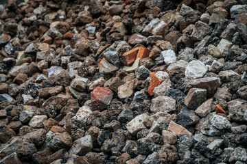 Textured City Pavement with Stone, Gravel, and Pebbles on Concrete Road