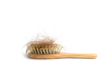 Hair loss and comb, hair loss every day, serious problems and hair loss on a white background. 
