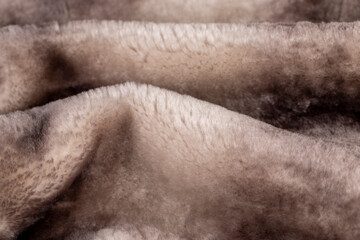 a close-up of a part of a fur coat made of sheepskin