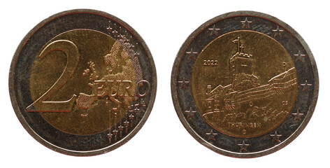 Wartburg Castle building in Eisenach, Thuringia on two euro coin Germany with Europe map, 2022