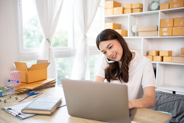 Business owner on the phone talking to a customer, Business owner taking orders from laptop, Packaging and Delivery, Packaging and Shipping.
