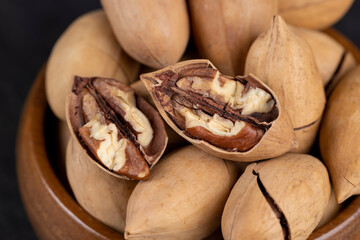 Unpeeled crunchy pecans close up