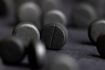 Open and unpacked tablets of black color close-up