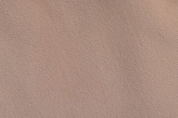 part of the fabric from beige-colored clothing