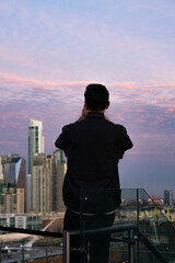 Fototapeta premium Buenos Aires skyline view from rooftop CCK during sunset, man taking photos