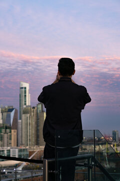 Buenos Aires skyline view from rooftop CCK during sunset, man taking photos