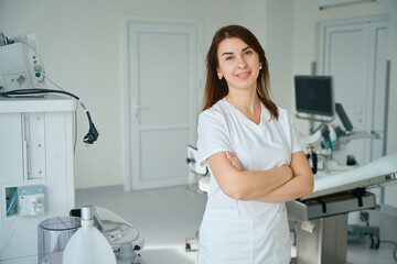 Portrait of beautiful female gynecologist in clinic