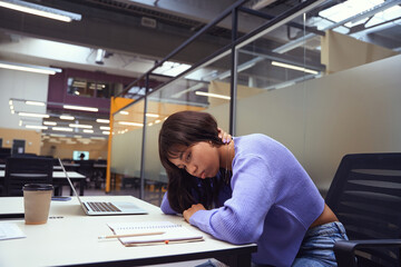 Photo of female employee in open space office